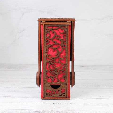 Wooden candle holder with red floral design on a white background