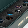 Set of polyhedral dice with gemstone-like finish in a 'Misfit Edition' box.