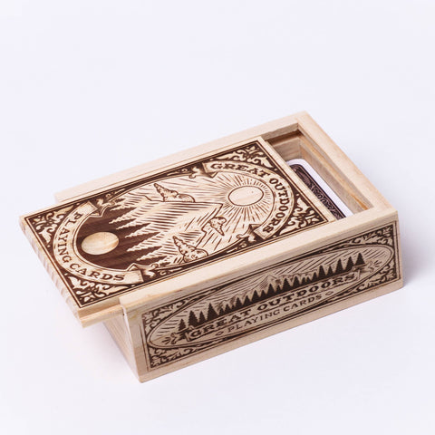 Wooden box with playing card design on a white background