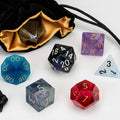 Set of colorful polyhedral dice with a drawstring bag on a white background