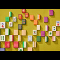 Colorful Mahjong tiles arranged on a yellow background