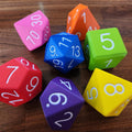 Colorful polyhedral dice on a wooden surface