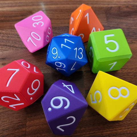 Colorful polyhedral dice on a wooden surface