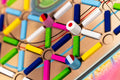Colorful wooden puzzle with interlocking pieces on a wooden board