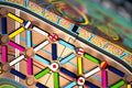 Colorful pinball machine with various colored balls and a British flag design.