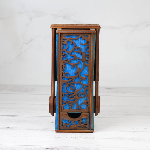 Wooden side table with blue decorative panel on a white background