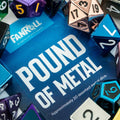 Collection of multicolored polyhedral dice with a 'Pound of Metal' box in the center.