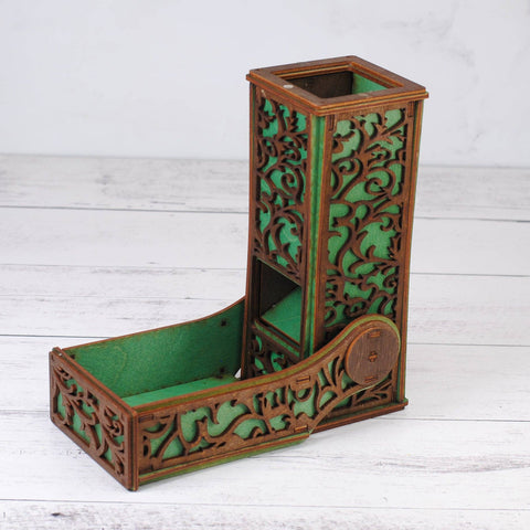 Decorative wooden pen holder with intricate carvings on a white wooden surface