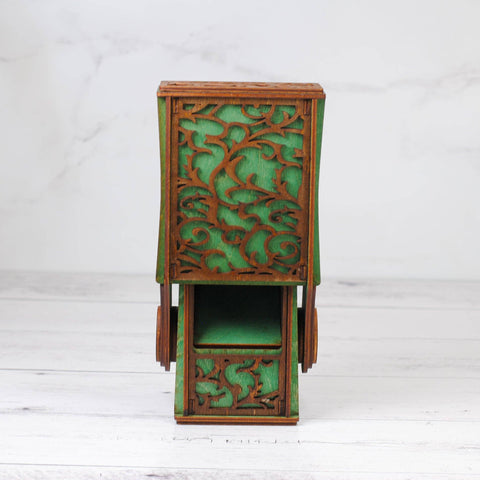 Decorative wooden box with intricate carvings on a white background