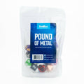 Packaged dice set with 'Pound of Metal' label on a white background