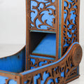 Decorative wooden shelf with blue interior on a white background