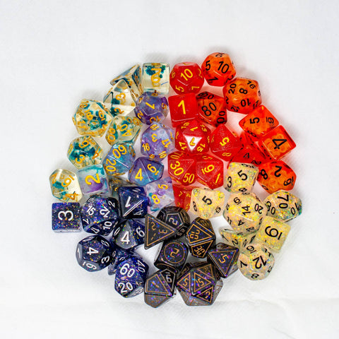 Assorted colorful polyhedral dice on a white background