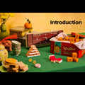 Vintage-style display with snacks, a clock, and a box labeled 'Griffin's' on a green tablecloth.