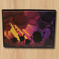 Silhouette design of four characters under a starry sky with trees on a wooden surface
