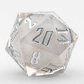 Clear polyhedral dice with silver numbers on a white background