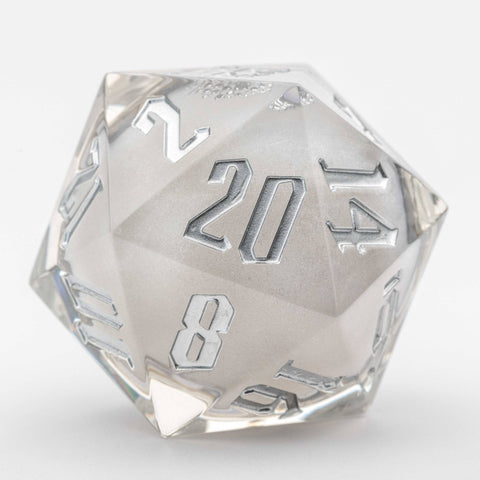 Clear polyhedral dice with silver numbers on a white background