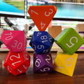 Colorful dice with numbers on a wooden surface