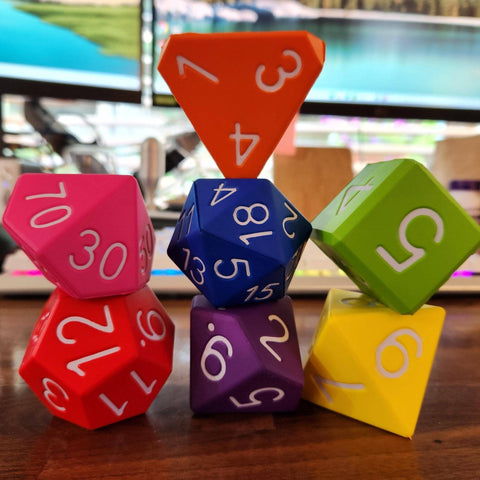 Colorful dice with numbers on a wooden surface