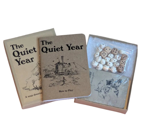 Two books titled 'The Quiet Year' on a white background with a package of wooden heart-shaped tokens.