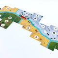 Set of colorful game board pieces on a white background