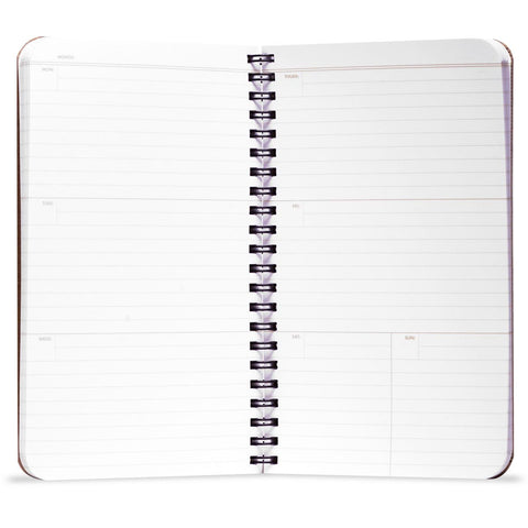 White notebook with black spiral binding on a white background