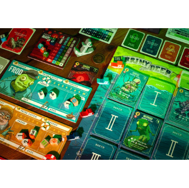 Board game with cards and pieces on a wooden table