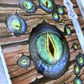 Close-up of a detailed monster eye illustration on a wooden background