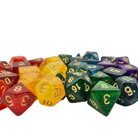 A group of polyhedral gaming dice in a rainbow color assortment with gold-colored numbers, photographed on a plain white background.