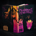 Book titled 'Pilgrimage of the Penitent' with artistic cover design on a dark background