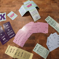 Collection of printed cards on a wooden surface