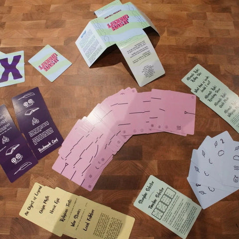 Collection of printed cards on a wooden surface
