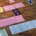 Colorful cards with various designs on a wooden floor
