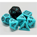 Set of turquoise and black polyhedral dice on a white background