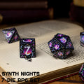 Set of polyhedral dice with colorful design on an open book, featuring 'BOTCH' branding.