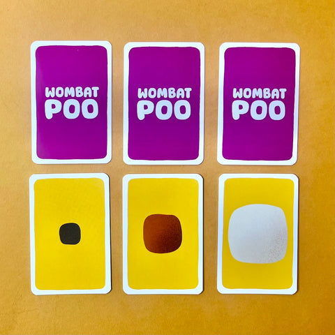 Six cards labeled 'Wombat Poo' with different colored representations on a yellow background
