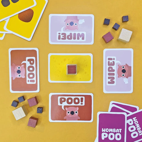 Board game components including cards and dice on a yellow background