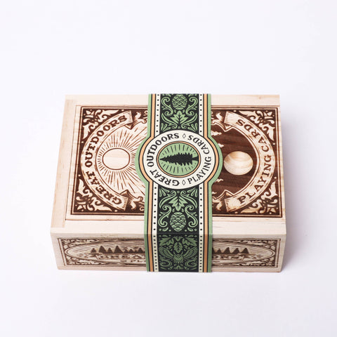 Wooden box with decorative design on a white background