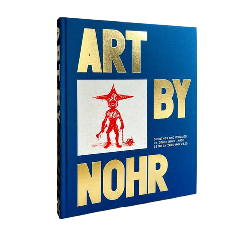 Book titled 'Art by Nohr' with a blue cover and gold text on a dark background