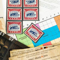 Collection of vintage stamps and postal memorabilia on a table.