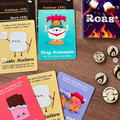 Collection of colorful cards with cartoon characters and text on a wooden surface