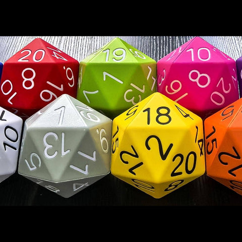 Assorted colored polyhedral dice on a dark surface