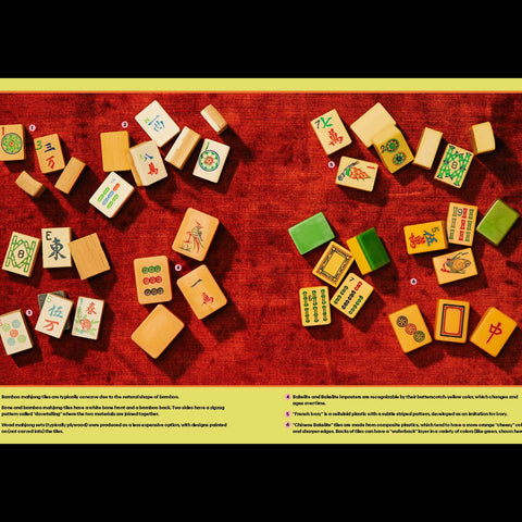 Colorful wooden tiles with various symbols arranged on a red surface